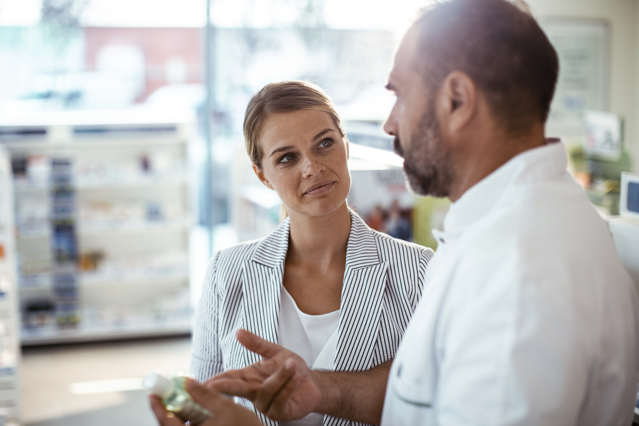 pharmacist providing patient with the right medication through technology solutions to manage inventory